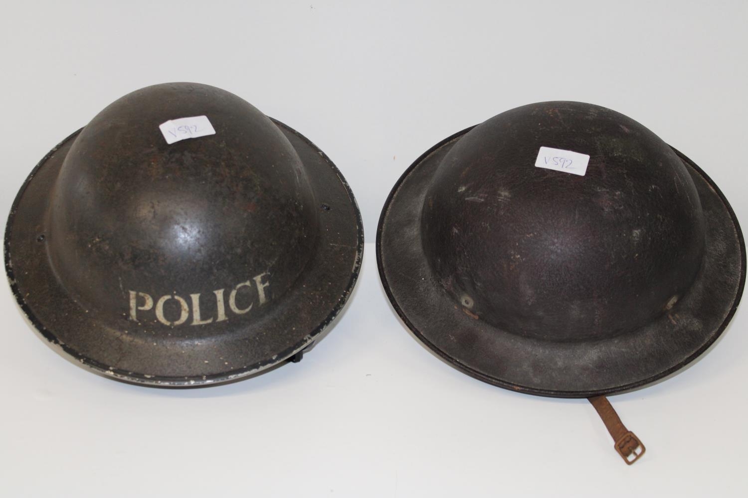 Two WW2 period tin helmets one by Hobson & Son London