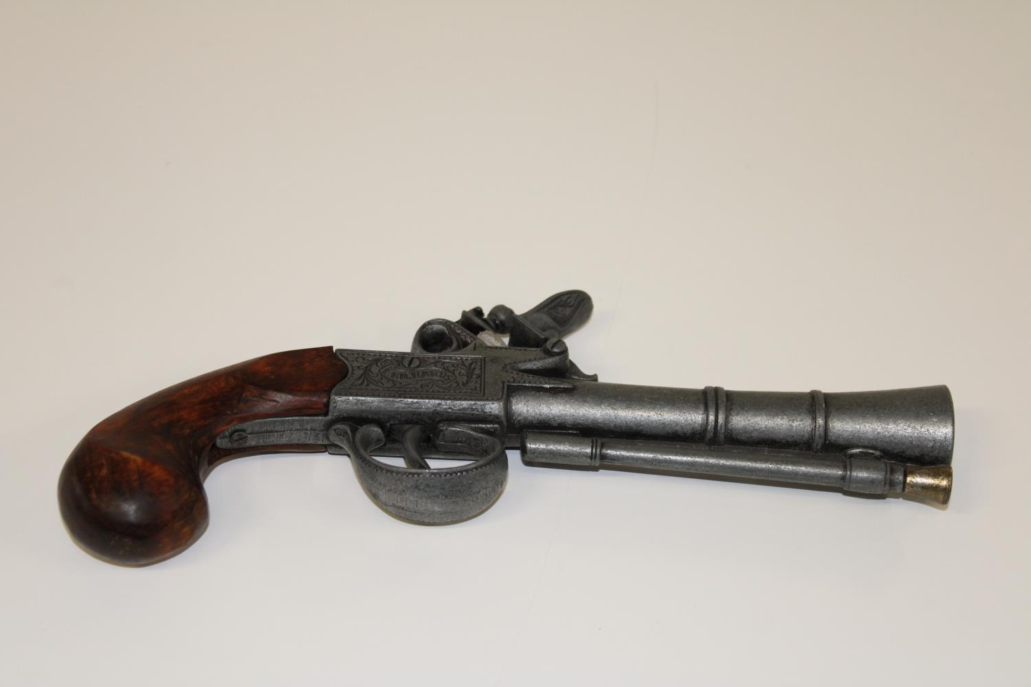 A replica flintlock pistol