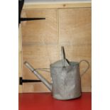 A vintage galvanized watering can