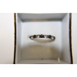 A 9ct gold sapphire half eternity ring size L