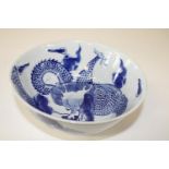 A Chinese blue & white dragon bowl with character marks to base (Sold as seen) dia 18cm
