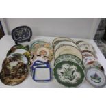 A box of assorted collectors plates