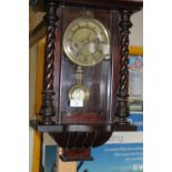 A vintage German mahogany cased wall clock (needs attention)