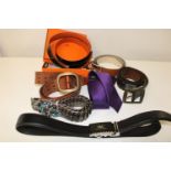 A box of belts & accessories including leather