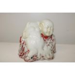 A Chinese 19th century export porcelain figure of a boy holding a dog 12cm
