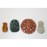 A selection of carved jade & tigers eye items