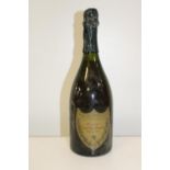 A bottle of 1964 Cuvee Dom Perignon champagne (contents on lower neck of the bottle)