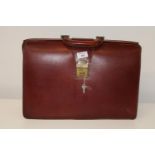 A vintage brown leather attache case