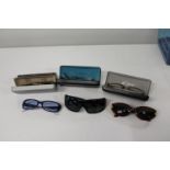 A selection of assorted sunglasses/glasses