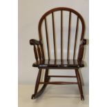 A vintage child's wooden rocking chair Collection only