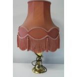 A vintage brass based table lamp & shade