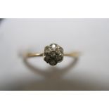 A 18ct gold & diamond cluster ring size J