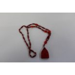 An Egyptian revival glass necklace