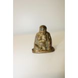A small 18th century Chinese bronze Buddha with character marks to the reverse (sold as seen)