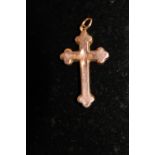 A 9ct rose gold crucifix 0.7 grams