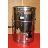 A stainless steel un-used water urn