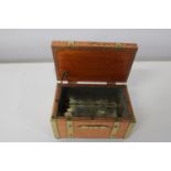 A vintage copper & brass tea caddy