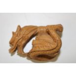 A carved boxwood netsuke