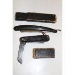 A boxed cut throat razor, and military style knife
