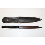 A wooden handled Fairbairn Sykes type Commando knife with sheath