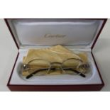 Rare Vintage Cartier Silver Spider Platinum Spectacle Frames in box with cloth. To the sides are the