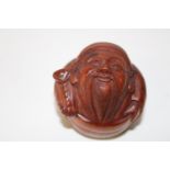 A carved boxwood netsuke