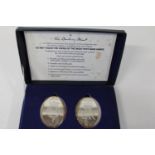 A boxed set of two Danbury Mint silver ingots struck for the Queens silver jubilee