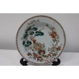 A 18th century Chinese dish with floral decoration (sold as seen)