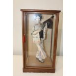 A vintage Japanese doll in a glass case 50x24x28cm Collection Only