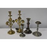 A selection of assorted vintage candlesticks