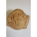 A carved boxwood netsuke