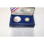 A 1987 United States Constitution coin set. $5.00 gold coin & Silver $1.00 coin with COA