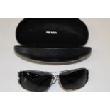 A pair of Prada black & chromed sunglasses in original case