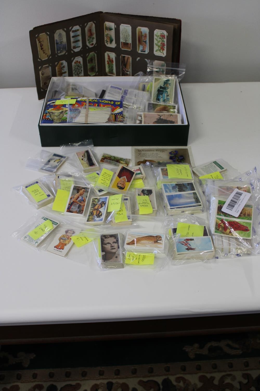 A job lot of assorted cigarette cards & other