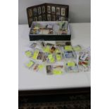 A job lot of assorted cigarette cards & other
