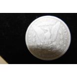 A 1880 American silver dollar (o)