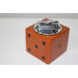 A vintage 1950's novelty bakelite table lighter in the form of a dice