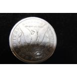 A 1886 American silver dollar (o)