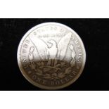 A 1890 American silver dollar (o)