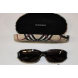 Burberry Rectangular Sunglasses with original case. Black coloured frames, decorated with the Nova