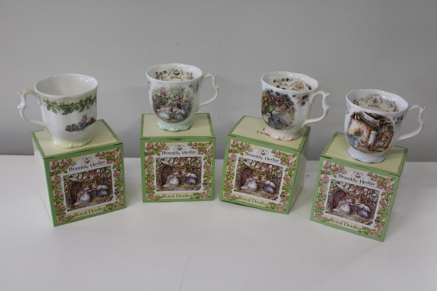 A set of four Brambly Hedge boxed mugs (The four seasons)
