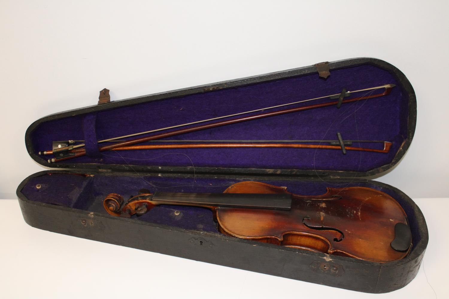 A Stainer violin & two bows in a coffin case with paper label inside which reads ' Jacubus
