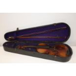 A Stainer violin & two bows in a coffin case with paper label inside which reads ' Jacubus