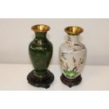 Two Oriental cloisonne vases on wooden stands. 18cm h