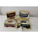 Four boxed Corgi bus models