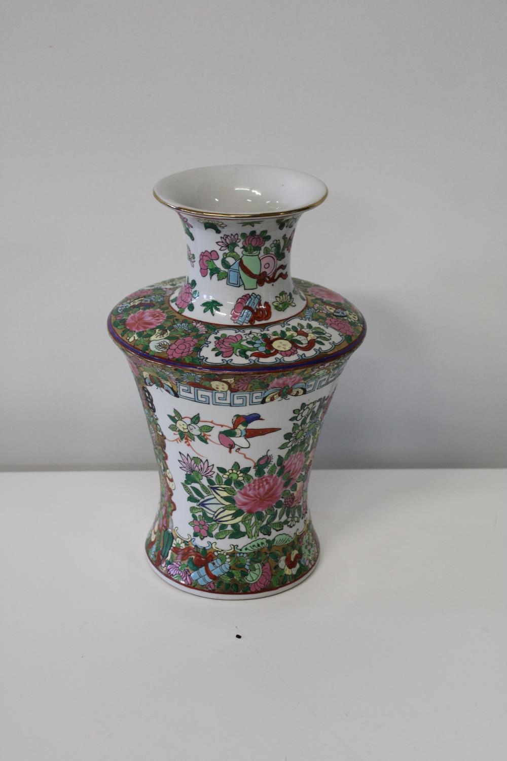 A Chinese Famille Rose vase with character marks to the base 31cm h