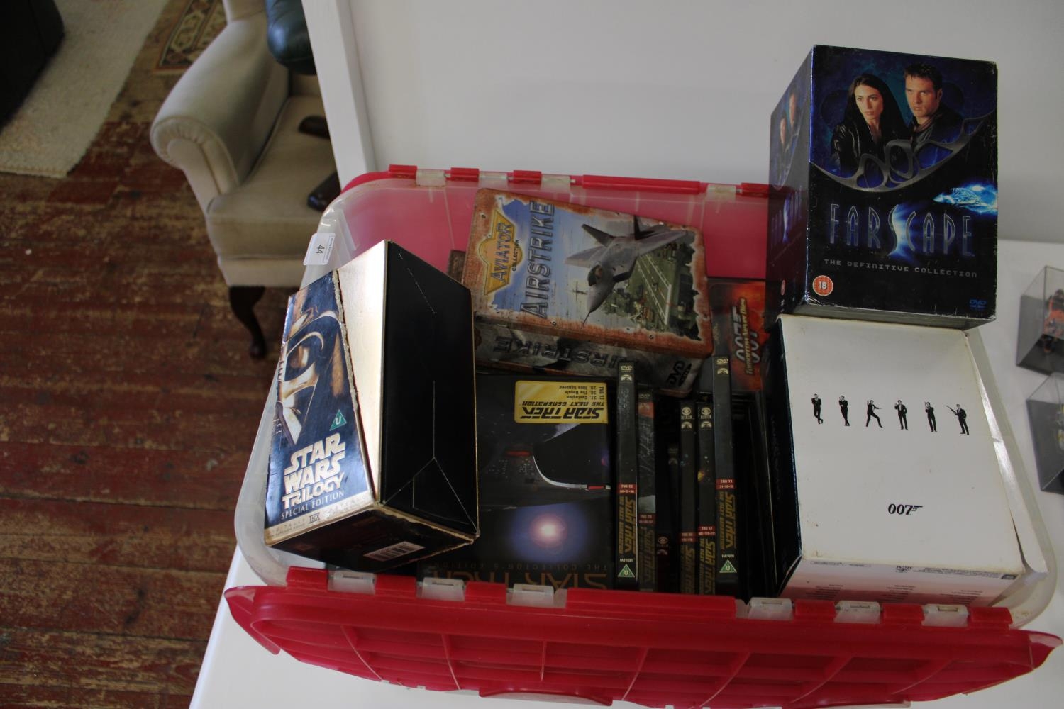 A box of Star Trek DVD's & other