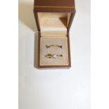 A 18ct gold diamond solitaire ring & 18ct gold band ring size L