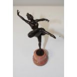 A bronze dancing figure on a marble base. 20cm total