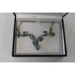 A large silver & blue topaz necklace